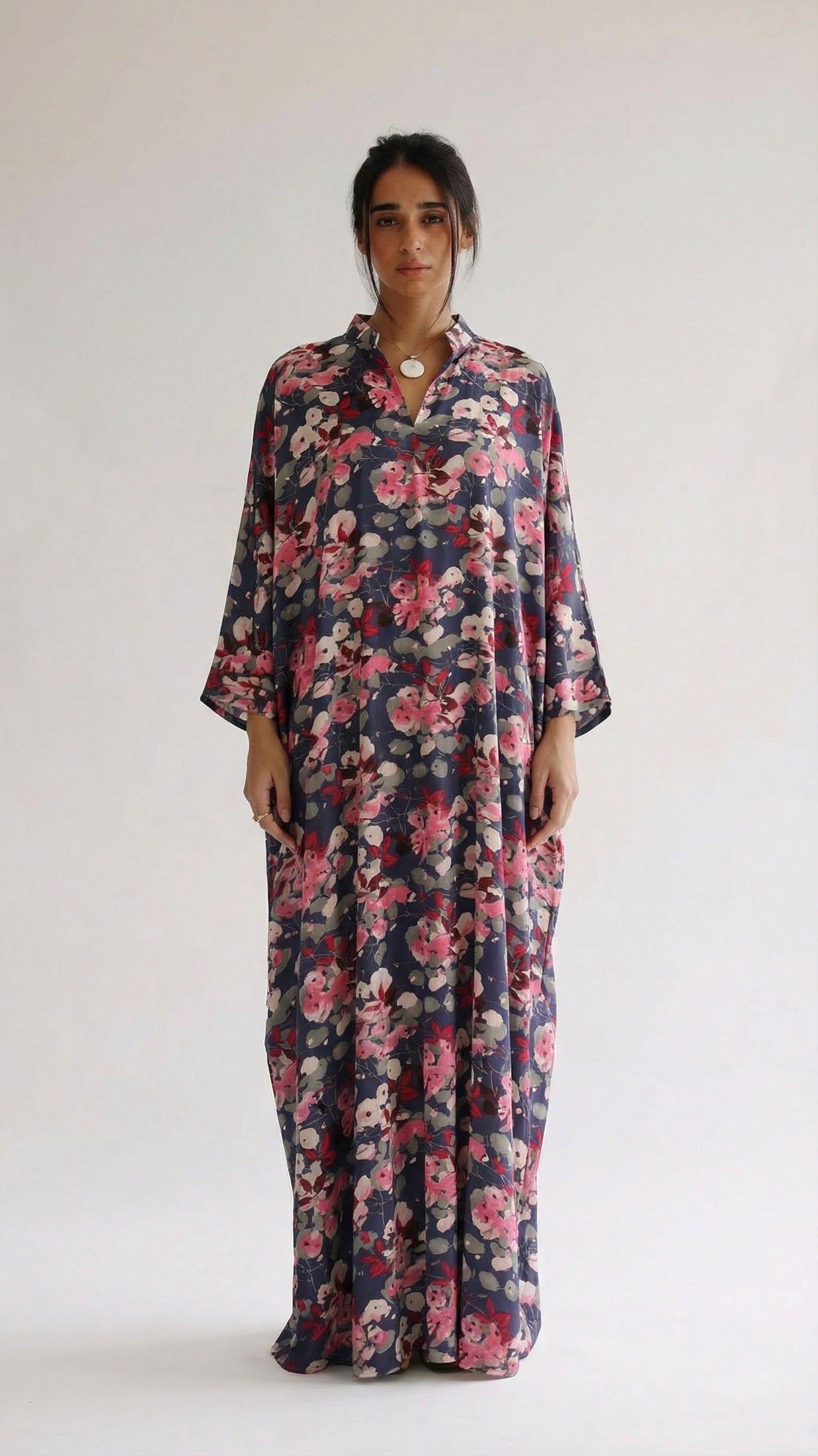 Woman wearing a floral dress on a white background